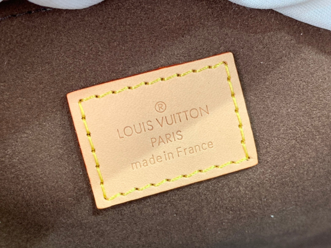 Pochette Métis East West Monogram Canvas Brown