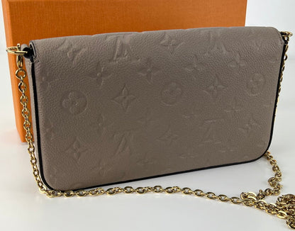 Bolsa Louis Vuitton empreinte pochette felicie in dune